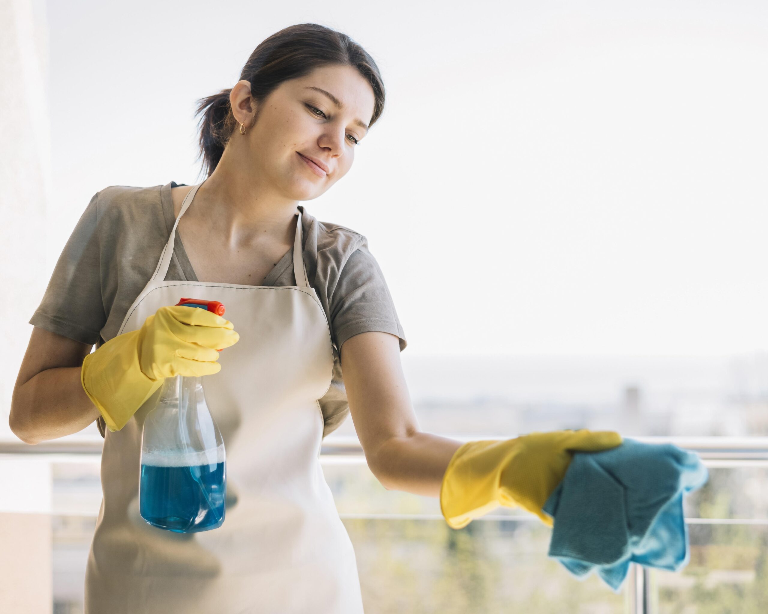 smiley-woman-cleaning-window